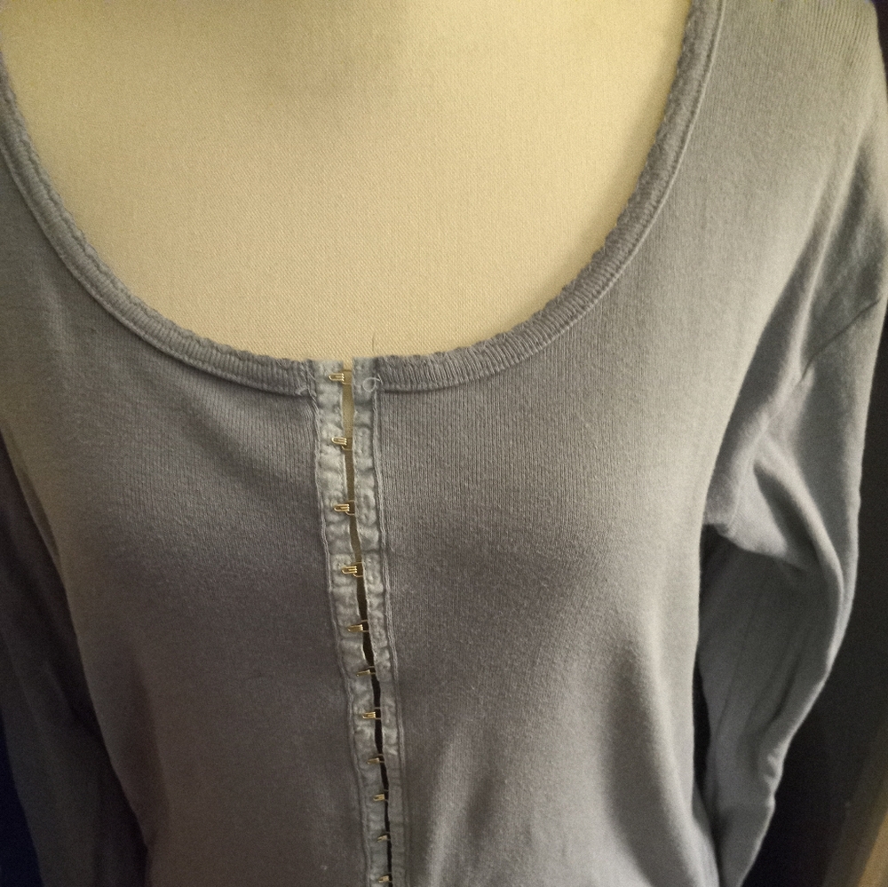 Not new,never worn dusty blue hook closures long sleeve cotton top size medium .